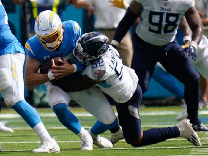Titans linebacker Harold Landry III (58) sacks Los Angeles Chargers quarterback Justin Herbert (10) in the fourth quarter at Nissan Stadium.
